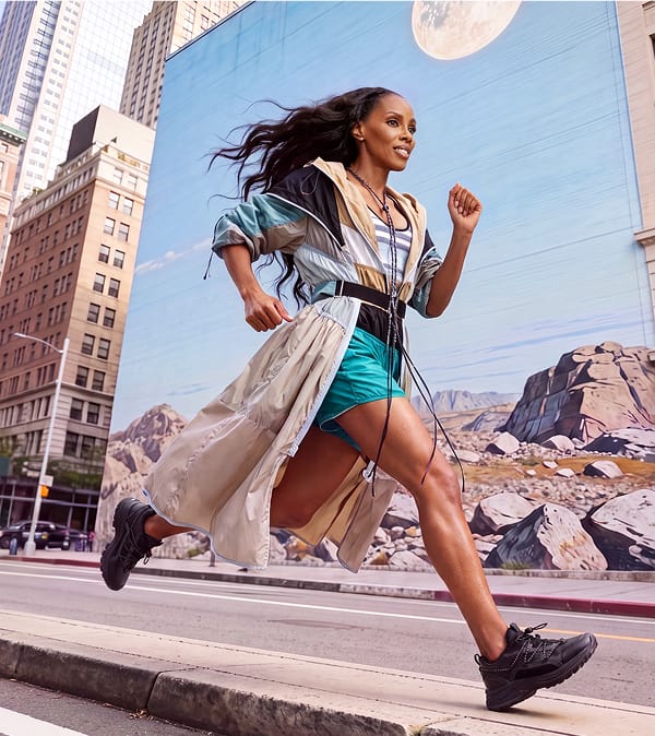 June Ambrose running while wearing the Trecca sneaker