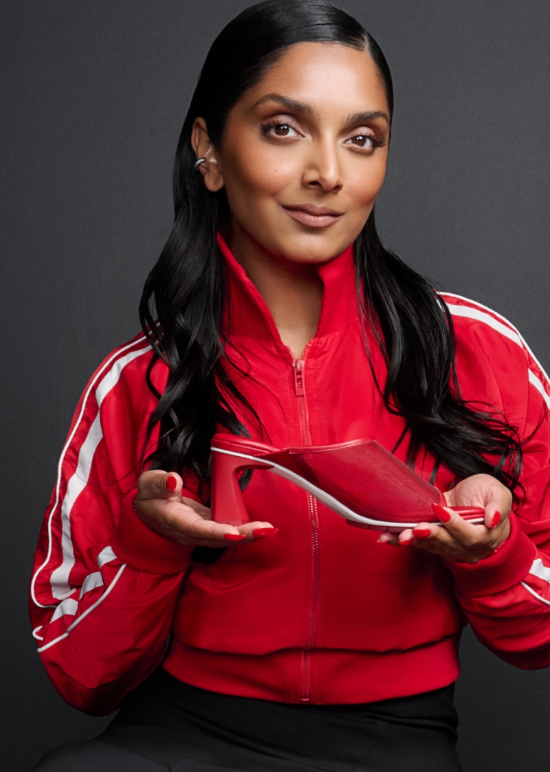 Deepica Mutyala holding the red Gamechanger Slide Heel