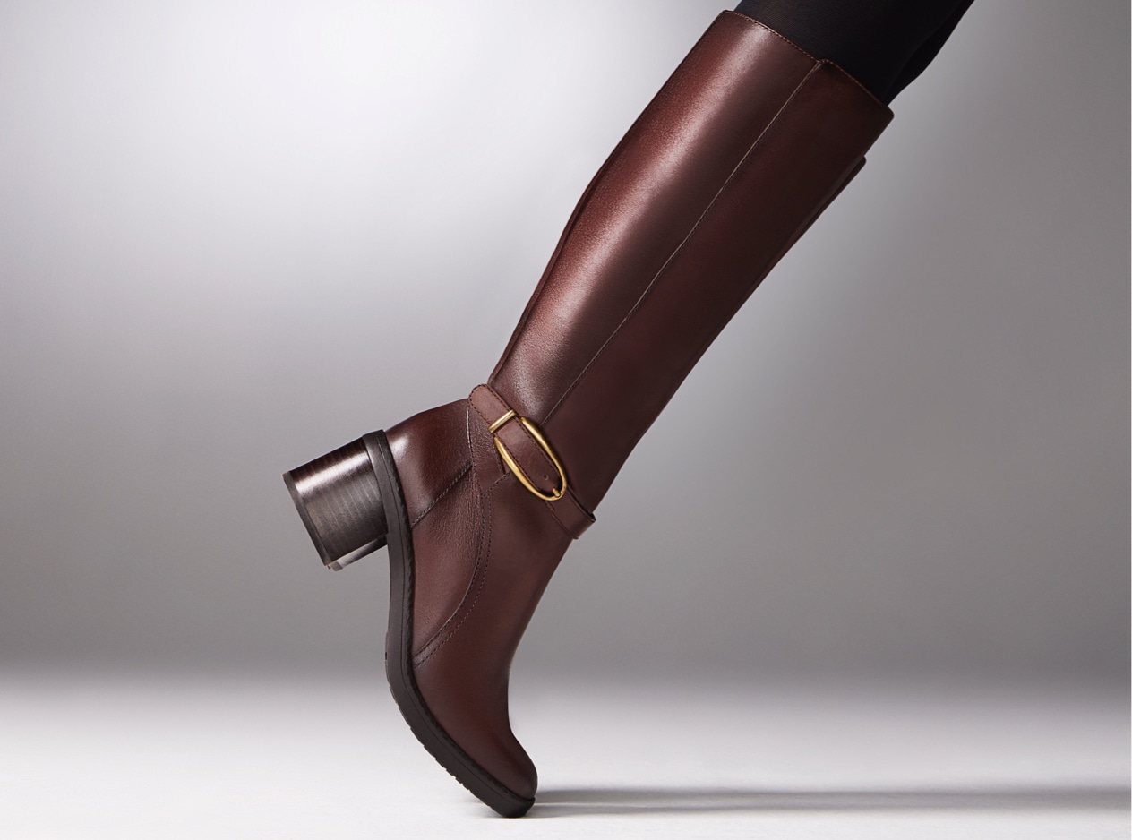 on toe image of a dark brown knee high riding boot